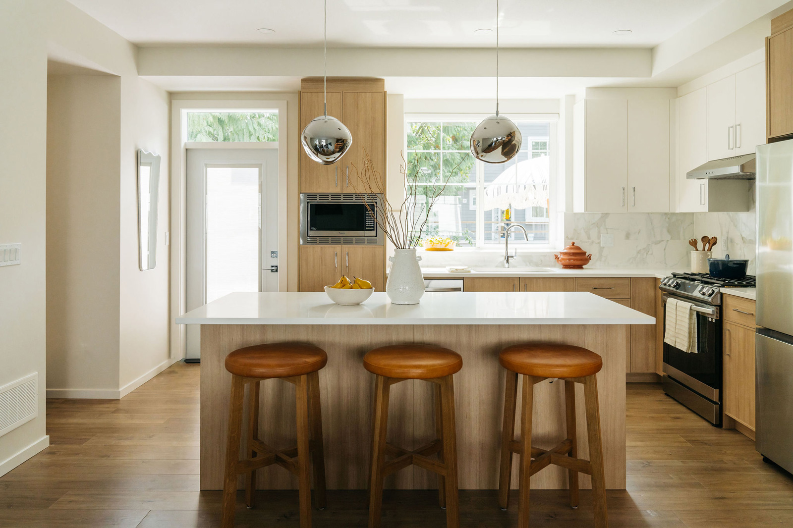 kinship living kitchen island with wooden barstools