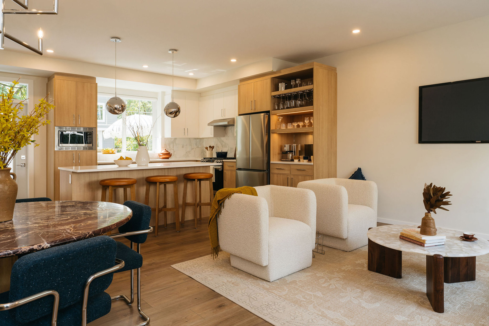 kinship living open living space with kitchen and balcony access
